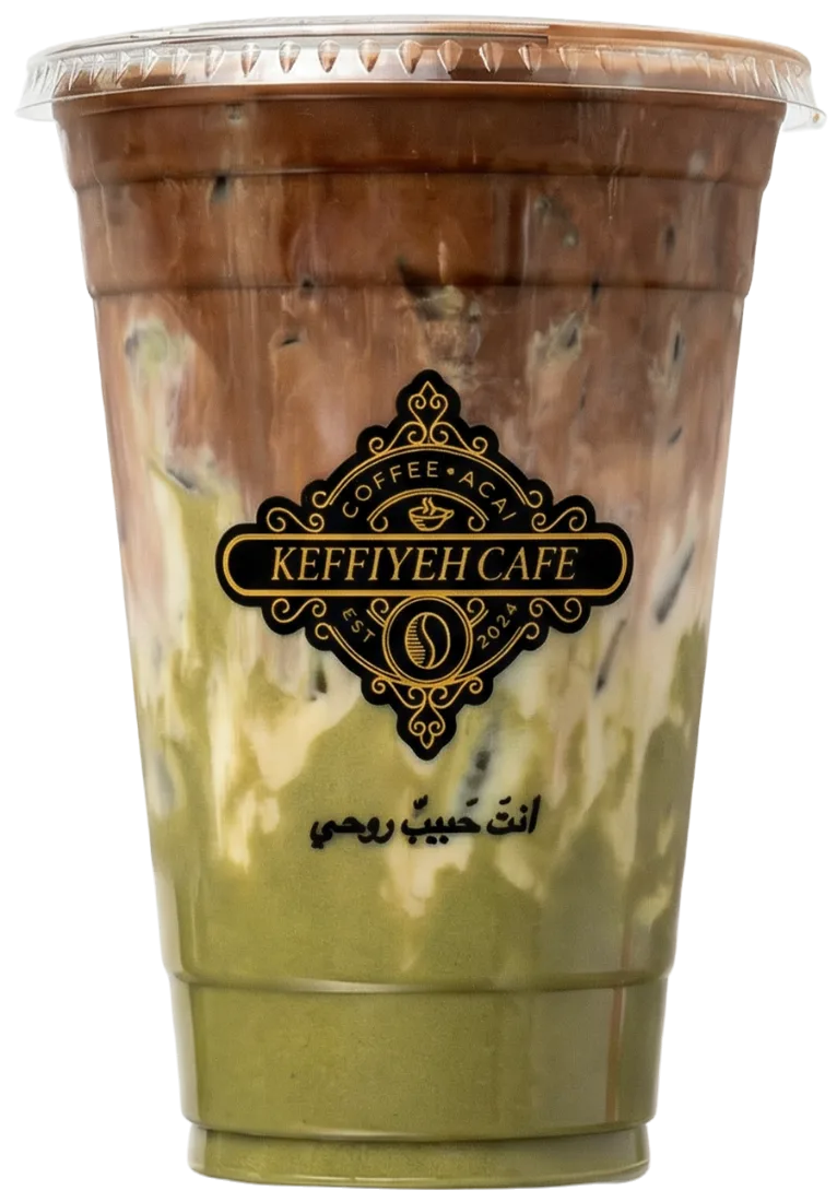 Iced pistachio latte in a Keffiyeh Cafe cup